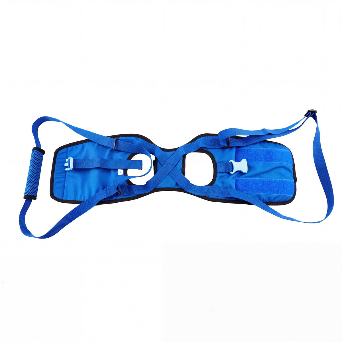 A woman standing beside her senior Labrador on the back porch steps, holding the handle of a blue rear support harness above the dog's hips